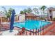 Community pool with lounge chairs for relaxing by the water at 2486 Citrus Club Ln # 408, Orlando, FL 32839