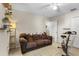 Bonus room featuring neutral walls, a comfy sofa, ceiling fan, and exercise bike at 281 Primrose Dr, Davenport, FL 33837