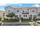 Charming two-story townhome with well-maintained landscaping and a welcoming facade at 281 Primrose Dr, Davenport, FL 33837