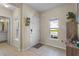 Bright foyer with tile flooring, natural light, and a charming mail station at 281 Primrose Dr, Davenport, FL 33837