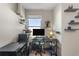 Functional home office featuring a window for natural light, floating shelves, and modern furnishings at 281 Primrose Dr, Davenport, FL 33837