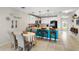 Inviting eat-in kitchen with a view of the dining area and modern decor at 281 Primrose Dr, Davenport, FL 33837
