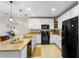Modern kitchen with stainless steel appliances, ample counter space, and stylish decor at 281 Primrose Dr, Davenport, FL 33837