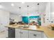 Open concept kitchen with a view of the living area, perfect for entertaining guests at 281 Primrose Dr, Davenport, FL 33837