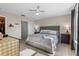 Comfortable bedroom featuring neutral tones, soft carpet, and a storage bedframe at 281 Primrose Dr, Davenport, FL 33837