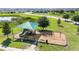 Community playground area featuring playground equipment, swings, benches, and ample shade at 281 Primrose Dr, Davenport, FL 33837