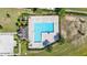 Aerial view of a community pool featuring a unique design, lounge area, and beautiful landscaping at 281 Primrose Dr, Davenport, FL 33837