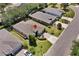 Aerial shot of a single-story home in a residential neighborhood, featuring mature landscaping and a brick driveway at 3677 Serena Ln, Clermont, FL 34711