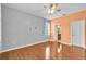 Bedroom featuring hardwood floors, a ceiling fan, and neutral color palette at 3677 Serena Ln, Clermont, FL 34711