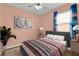 Comfortable bedroom featuring a calming color scheme, ceiling fan, and natural light at 3677 Serena Ln, Clermont, FL 34711