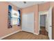 Bedroom with closet, plank floors, and peach paint at 3677 Serena Ln, Clermont, FL 34711