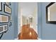 Inviting foyer features gleaming hardwood floors and a view of the spacious living area beyond at 3677 Serena Ln, Clermont, FL 34711