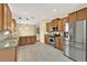 Open kitchen area with stainless steel appliances and ample countertop space at 3677 Serena Ln, Clermont, FL 34711