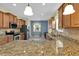 Modern kitchen with a large island and stainless steel appliances is perfect for cooking and entertaining guests at 3677 Serena Ln, Clermont, FL 34711