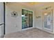 Patio with tile floors and a glass door leading inside at 3677 Serena Ln, Clermont, FL 34711