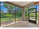 Screened patio with tile floors and a view of the landscaped backyard at 3677 Serena Ln, Clermont, FL 34711