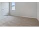 Light and airy bedroom with wall to wall carpet, a modern window and white painted trim at 3975 Kennebunk Loop, Mount Dora, FL 32757