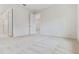 Bright bedroom with neutral carpet, and a doorway leading to a bathroom at 3975 Kennebunk Loop, Mount Dora, FL 32757