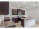 Well-equipped kitchen featuring stainless steel appliances, granite counters, and a center island at 3975 Kennebunk Loop, Mount Dora, FL 32757