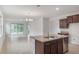 Bright and open living area with large sliding glass doors leading to the outdoors at 3975 Kennebunk Loop, Mount Dora, FL 32757