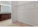 Walk in Closet adjacent to bathroom with granite countertop at 3975 Kennebunk Loop, Mount Dora, FL 32757
