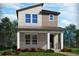 Modern two-story home with covered porch, mixed siding, manicured lawn, and well-maintained landscaping at 4533 Cross Prairie Pkwy, St Cloud, FL 34772