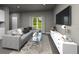Cozy living room with large sectional sofa, area rug, modern furniture, and natural light at 4533 Cross Prairie Pkwy, St Cloud, FL 34772