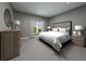 Spacious main bedroom with plush carpeting, ensuite bathroom, large bed, and natural light at 4533 Cross Prairie Pkwy, St Cloud, FL 34772