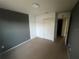 Bedroom featuring neutral carpet and a closet for storage at 4650 Staghorn Dr # 500, Orlando, FL 32808