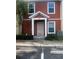 Close-up of the front entrance with a decorative storm door, manicured bushes, and modern siding at 4650 Staghorn Dr # 500, Orlando, FL 32808