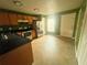 Well-lit kitchen featuring modern appliances, ample cabinet space, and durable tile floors at 4650 Staghorn Dr # 500, Orlando, FL 32808