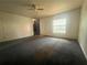 Expansive living room with neutral walls and ceiling fan at 4650 Staghorn Dr # 500, Orlando, FL 32808