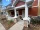Inviting front porch with stone-detailed columns and a secure storm door, perfect for relaxing at 4650 Staghorn Dr # 500, Orlando, FL 32808