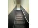 Carpeted stairway with painted walls at 4650 Staghorn Dr # 500, Orlando, FL 32808