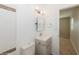 Bathroom featuring a vanity, decorative mirror, updated fixtures, and tiled shower at 4816 Crow St, Orlando, FL 32819