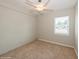 This compact bedroom offers a ceiling fan, closet, and window, creating a comfortable and well-lit space at 4816 Crow St, Orlando, FL 32819