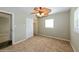 This bedroom features neutral walls, plush carpet, and one window that allows ample natural light at 4816 Crow St, Orlando, FL 32819