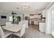 Open layout with dining, living, and a glimpse of the updated kitchen at 4816 Crow St, Orlando, FL 32819