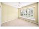 Bedroom with large windows and neutral walls at 487 Foxhill Dr, Debary, FL 32713