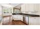 Kitchen featuring white cabinets, stainless steel appliances, and granite countertops at 487 Foxhill Dr, Debary, FL 32713