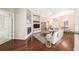 Open living room with hardwood floors, fireplace, and built-in shelving at 487 Foxhill Dr, Debary, FL 32713