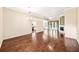 Spacious living area with hardwood floors and a view of the pool through glass doors at 487 Foxhill Dr, Debary, FL 32713
