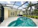 Screened in pool area featuring a kidney-shaped pool with hot tub on the side at 487 Foxhill Dr, Debary, FL 32713