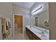 Bathroom featuring double sinks, a large mirror, and a separate shower at 5154 Majestic Woods Pl, Sanford, FL 32771
