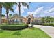 Beautiful single-story home showcasing well-manicured landscaping and a welcoming circular driveway at 5154 Majestic Woods Pl, Sanford, FL 32771