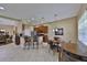 Kitchen with stainless steel appliances, breakfast bar, and adjacent dining area at 5154 Majestic Woods Pl, Sanford, FL 32771