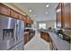 Bright kitchen with stainless steel refrigerator and lots of counter space at 5154 Majestic Woods Pl, Sanford, FL 32771