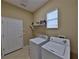 Laundry room with tile flooring, a washing machine, and a dryer at 5154 Majestic Woods Pl, Sanford, FL 32771