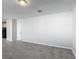 Bright and airy living space with tiled flooring, offering an open and versatile layout, next to a door and a kitchen area at 596 Sun Warbler Way, St Cloud, FL 34771