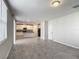 Spacious living room with tile flooring, ample natural light, and an open layout, perfect for entertaining at 596 Sun Warbler Way, St Cloud, FL 34771